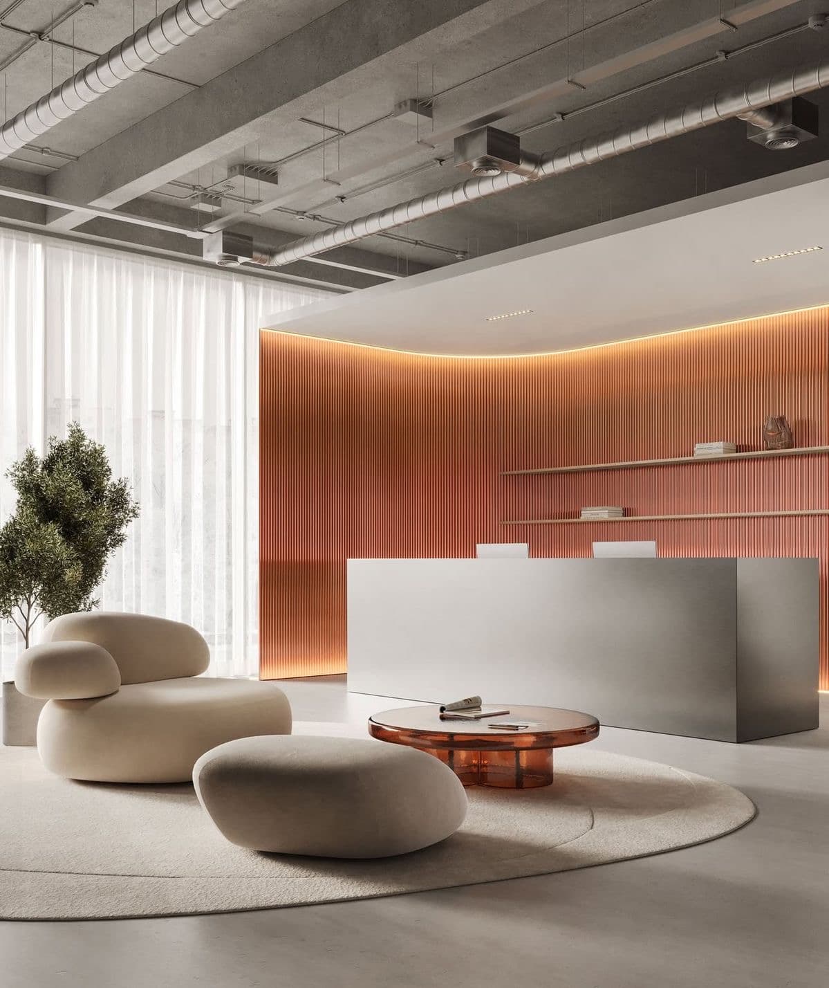 Minimalist reception area with a silver desk, curved orange wall, and pebble-shaped cream furniture.